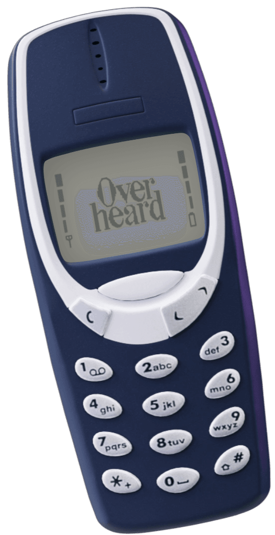 An old Nokia dumb phone with a screen that says 'Overheard'